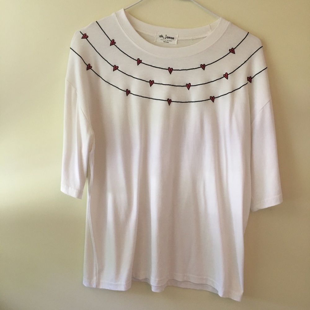 white t-shirt with red hearts